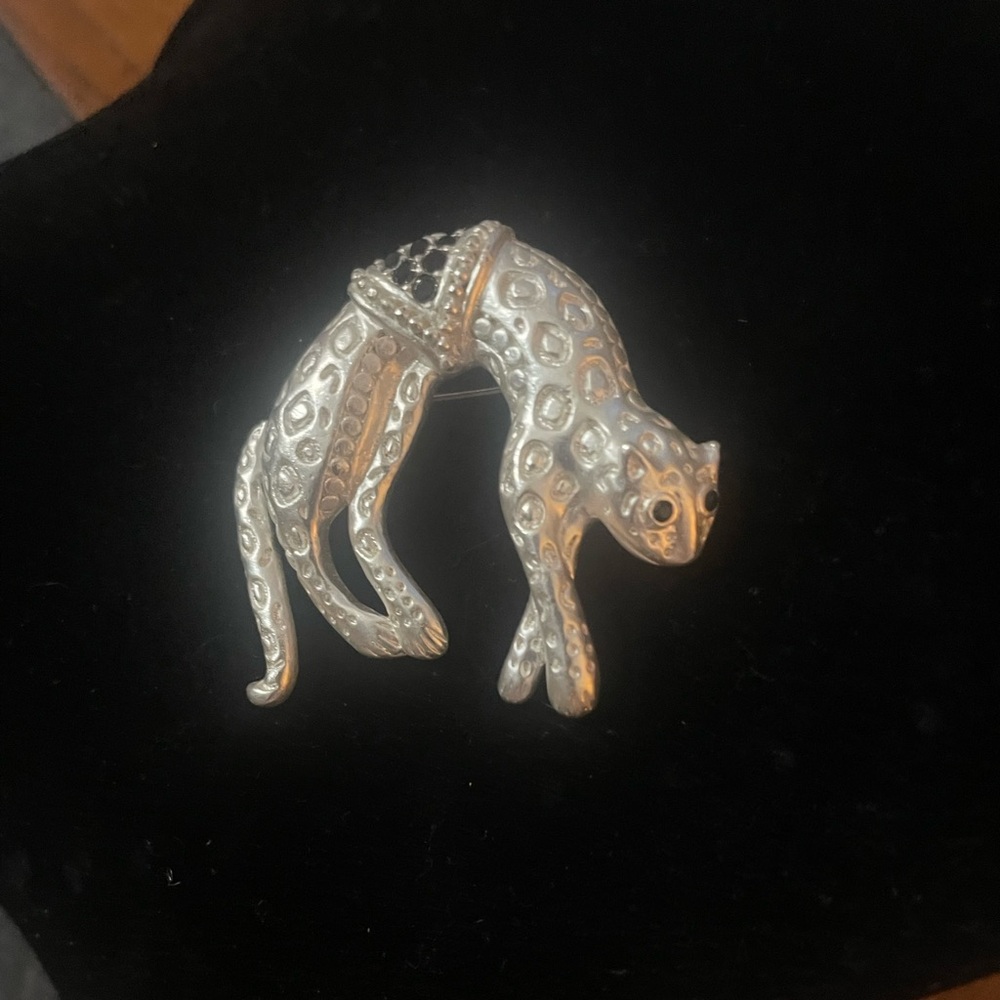 Three Brooches